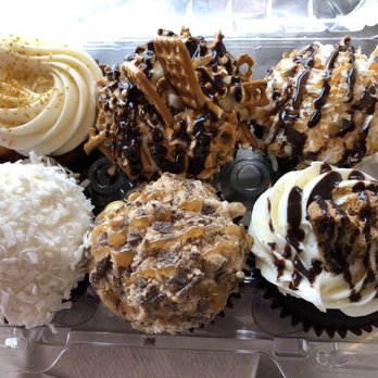 Cute As A Cupcake - Upper L, going clockwise: wedding cake, chocolate pb pretzel, caramel delight, cookie dough, toffee caramel, coconut - Cupcakes Near Me - Merrillville, Indiana Cute As A Cupcake - Upper L, going clockwise: wedding cake, chocolate pb pretzel, caramel delight, cookie dough, toffee caramel, coconut - Cupcakes Near Me - Merrillville, Indiana