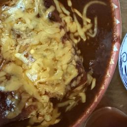 Cheese Enchiladas swimming in chili sauce
