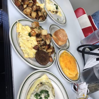 Louie's Cafe - Shrimp and crawfish omelette, potatoes, biscuit, cheese grits, sausage, bacon, and scrambled eggs - Breakfast & Brunch Near Me - Baton Rouge, Louisiana Louie's Cafe - Shrimp and crawfish omelette, potatoes, biscuit, cheese grits, sausage, bacon, and scrambled eggs - Breakfast & Brunch Near Me - Baton Rouge, Louisiana
