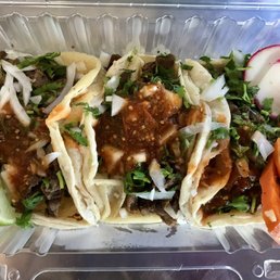 Three steak tacos to-go - They were good! Three steak tacos to-go - They were good!