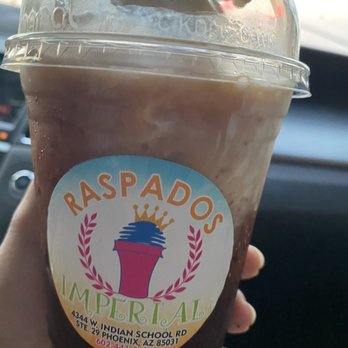 Raspados Imperial - a hand holding a cup of iced coffee - Coffee & Tea Near Me - Phoenix, Arizona Raspados Imperial - a hand holding a cup of iced coffee - Coffee & Tea Near Me - Phoenix, Arizona