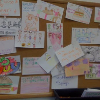 Five Guys - a bulletin board covered with children's drawings - Burgers Near Me - Livonia, Michigan