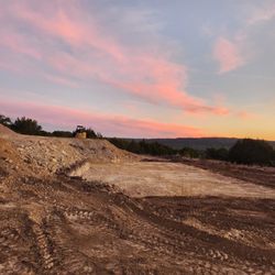 Keith And Wolf Demolition And Excavation Services - Pad site on a home being built on a hill. We cut thru rock and leveled it to within 1/2"!