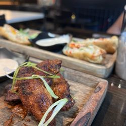 Black Spice - Black spice wings + lobster egg rolls.
