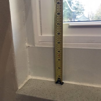Elysium Restoration Design - Exterior trim used on the interior to hide the fact the windows were measured and ordered 4"+ too small. Terrible caulk work - General Contractors Near Me - St. Peters, Missouri Elysium Restoration Design - Exterior trim used on the interior to hide the fact the windows were measured and ordered 4"+ too small. Terrible caulk work - General Contractors Near Me - St. Peters, Missouri