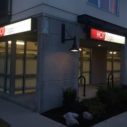 Hot Yoga Milwaukee - Evening outside our studio.  Inside you'll find two large hot yoga rooms, locker rooms with showers, and a spacious lobby & retail area