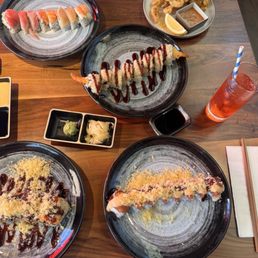 Upper left is rainbow roll then calamari. Middle is the shrimp crunch roll. Below left is volcano roll and bottom right is spicy rose roll