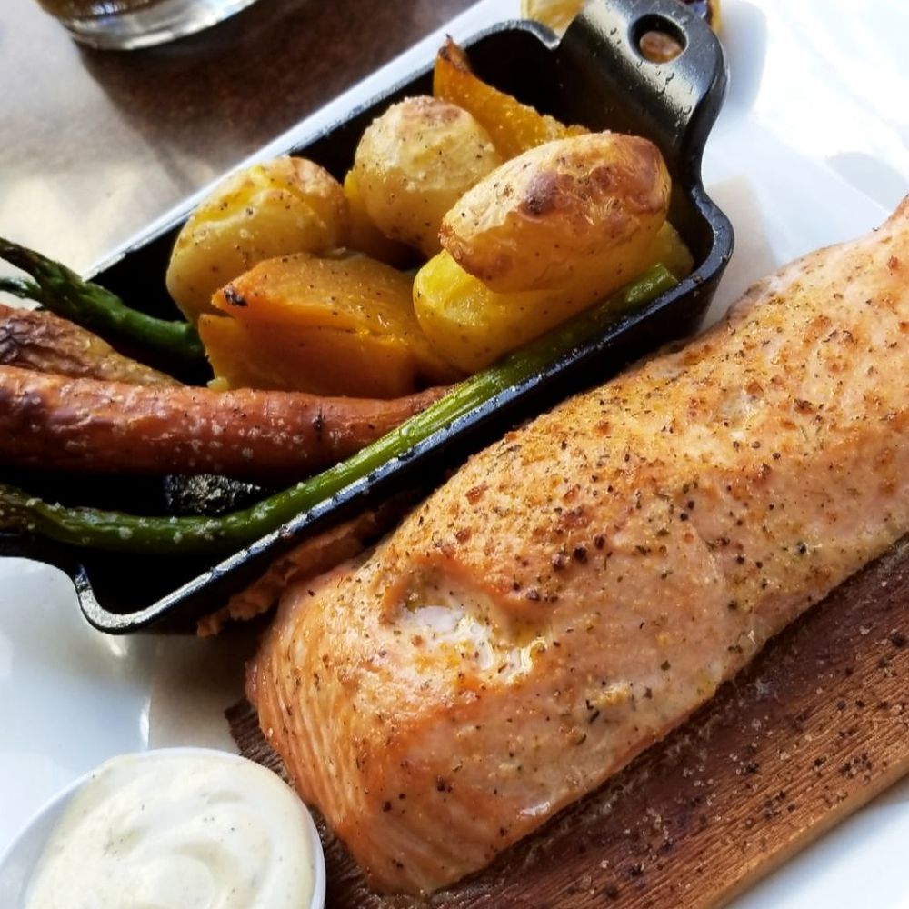 Seasons 52 - Salmon with vegetables and potatoes. - New American Near Me - Houston, Texas