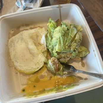 First Watch - Avocado toast with egg. Yum!! to go box doesn't look as pretty as it did at the beginning on the plate, but it sure tastes amazing!! - Breakfast & Brunch Near Me - Santa Rosa Beach, Florida