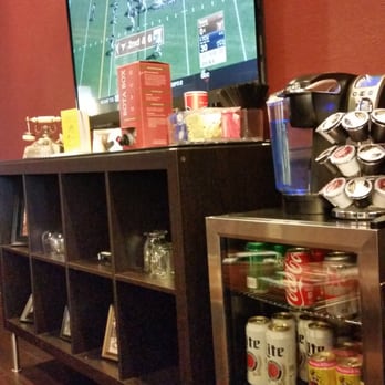 Finley’s Barber Shop - Complimentary Drinks and the game on the screen - Barbers Near Me - Plano, Texas