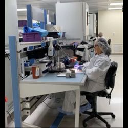 Advanced Bionics - Snapshot of a worker assembling a CI magnet