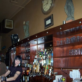 Crow Bar - a woman behind a bar counter - Dive Bars Near Me - Portland, Oregon
