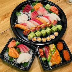 Sushi and Sashimi for 2, Yellowtail, white tuna and salmon sashimi. Ikura sushi and a Perfect Rainbow Roll.
