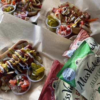 Disfruta - hotdogs and chips on a table - Food Trucks Near Me - Goleta, California