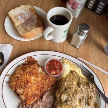 Joe's Place Paso Robles - Chili Verde Omelette with their famous sourdough bread. They really butter the toast here!! - Breakfast & Brunch Near Me - Paso Robles, California Joe's Place Paso Robles - Chili Verde Omelette with their famous sourdough bread. They really butter the toast here!! - Breakfast & Brunch Near Me - Paso Robles, California