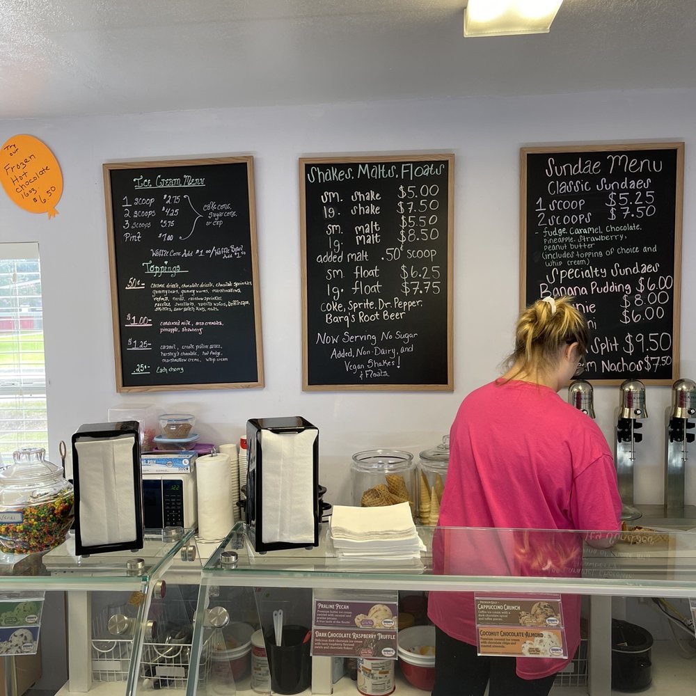 a woman behind the counter a woman behind the counter