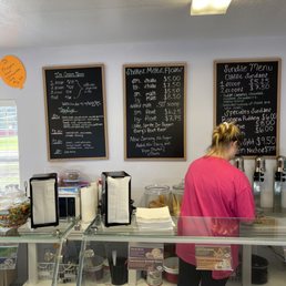 a woman behind the counter a woman behind the counter