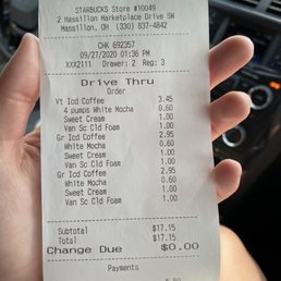 a person holding a receipt in their hand