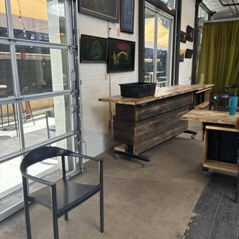 MoonGoat Coffee Roasters - The tables in the corner and chairs randomly scattered. - Coffee Roasteries Near Me - Costa Mesa, California