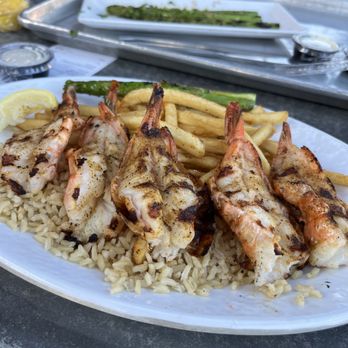California Fish Grill - Giant shrimp with regular fries and brown rice. You have to try these. A little lemon or garlic butter will definitely give it that kick. - Seafood Near Me - Redlands, California