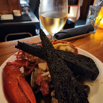 Water Street Kitchen - Cioppino with squid ink bread - Bars Near Me - Woods Hole, Massachusetts