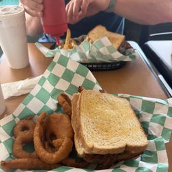 Razzle Dazzle burger with onion rings (front) and big daddy with fries (back)