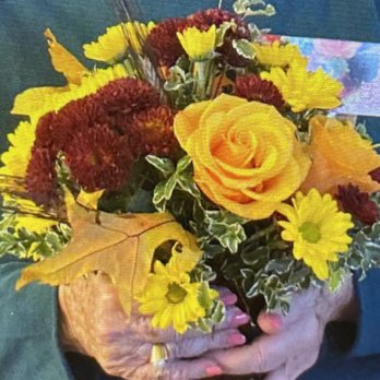 Chico Florist - This is the bouquet she received. It looks NOTHING like the photo. Daisies?? I paid $62+ for this?? - Florists Near Me - Chico, California