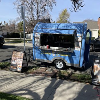 Tastee Flavors - a blue food truck parked on the side of the road - Food Trucks Near Me Tastee Flavors - a blue food truck parked on the side of the road - Food Trucks Near Me