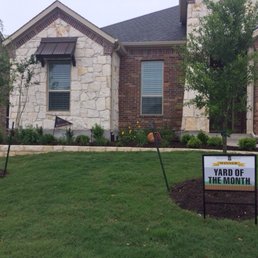 a yard sign in front of a house a yard sign in front of a house