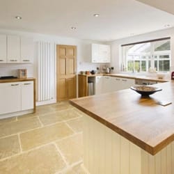 Münter Design & Build - English style country kitchen with custom oak counters and large format sandstone floor.