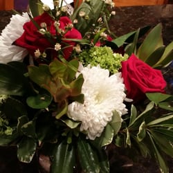 Doug The Florist - Flower arrangement 2 weeks after it arrived. All I did to help it along was to change the water. Still beautiful!