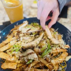 1881 Restaurant & Bar - We added some grilled chicken to our loaded cheese fries.