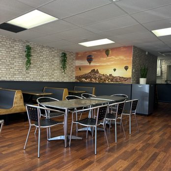 Kapadokia Grill - Mediterranean Turkish - a dining area with a table and chairs - Turkish Near Me - Greensboro, North Carolina Kapadokia Grill - Mediterranean Turkish - a dining area with a table and chairs - Turkish Near Me - Greensboro, North Carolina