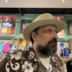 Cruise Kauai Boutique - 10/21/22 Hubby found his hat! That's an original Aloha Shirt he's wearing hand tailored by Jacqueline on Kaua'i