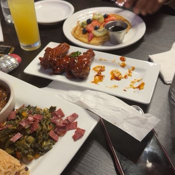 Dunns River Island Cafe - Wings and side of pancakes in the table - Caribbean Near Me - Tampa, Florida