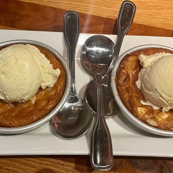 BJ's Restaurant & Brewhouse - White Chocolate Macadamia Nut Pizookie (small 2 of them) - Pizza Near Me - Slidell, Louisiana BJ's Restaurant & Brewhouse - White Chocolate Macadamia Nut Pizookie (small 2 of them) - Pizza Near Me - Slidell, Louisiana