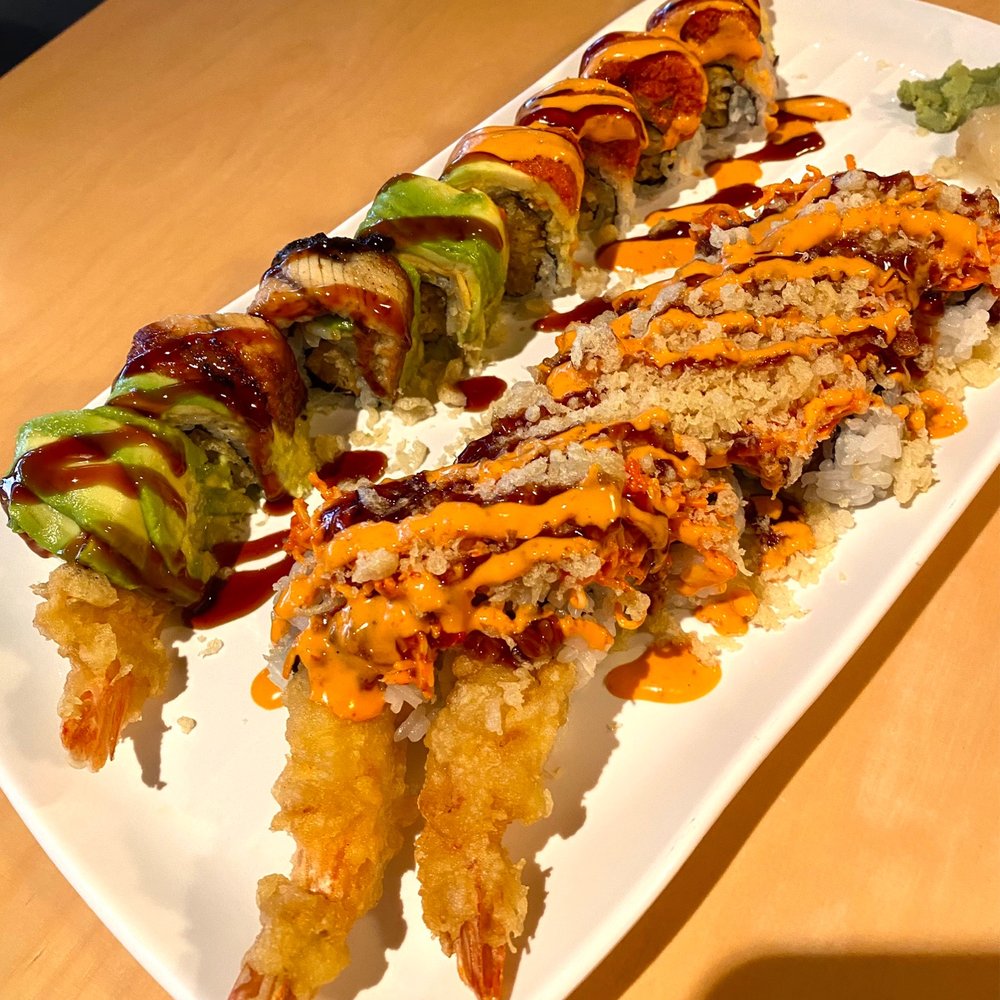Saica Restaurant - Half & half 1/2 Dragon Roll (bottom left) and 1/2 Red Roll (top left). Fire Cracker Roll (right) - Japanese Near Me - Ann Arbor, Michigan