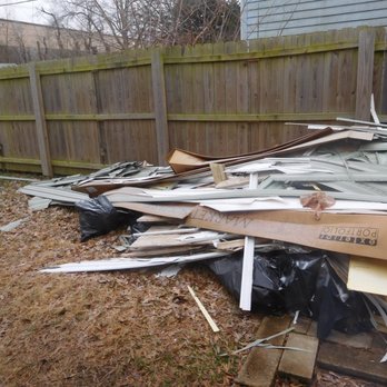 Go Eco Exteriors - left side of trash pile in back yard - Roofing Near Me - Ballwin, Missouri Go Eco Exteriors - left side of trash pile in back yard - Roofing Near Me - Ballwin, Missouri