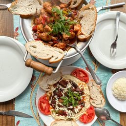 Top: chicken stew with mushrooms and peppers. Bottom: whipped eggplant layered with cheddar cheese and spiced beef Top: chicken stew with mushrooms and peppers. Bottom: whipped eggplant layered with cheddar cheese and spiced beef