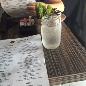 Flavio Restaurant DC - Mason jar water glasses and live plant on the table which is a nice touch - Italian Near Me - Washington, DC, District of Columbia
