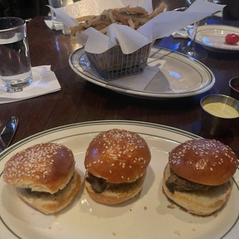 LUXBAR - Fillet Sliders, with Truffle fries in the background - Bars Near Me - Chicago, Illinois LUXBAR - Fillet Sliders, with Truffle fries in the background - Bars Near Me - Chicago, Illinois