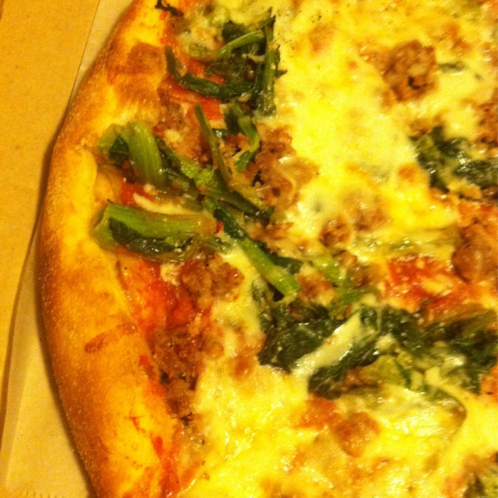 Romano's on the Beach - The Ferroni pizza: broccoli rabe, sausage, garlic, mozzarella. - Italian Near Me - Saint Augustine, Florida Romano's on the Beach - The Ferroni pizza: broccoli rabe, sausage, garlic, mozzarella. - Italian Near Me - Saint Augustine, Florida