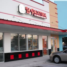 a car parked in front of a restaurant