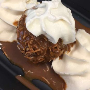 Uncle Julio's - cajeta -- fried vanilla ice-cream covered in toasted coconut and caramel sauce with whip cream. Delish! - Tex-Mex Near Me - Reston, Virginia Uncle Julio's - cajeta -- fried vanilla ice-cream covered in toasted coconut and caramel sauce with whip cream. Delish! - Tex-Mex Near Me - Reston, Virginia