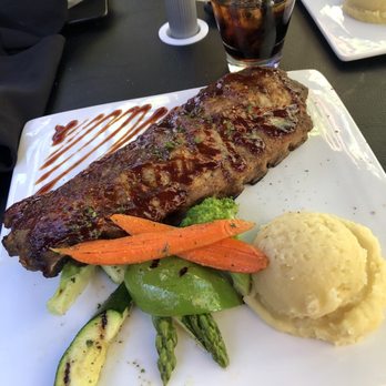 Tag Bar and Steakhouse - Ribs with garlic mashed potatoes and perfectly done veggies - Sports Bars Near Me - Edmonton, Alberta Tag Bar and Steakhouse - Ribs with garlic mashed potatoes and perfectly done veggies - Sports Bars Near Me - Edmonton, Alberta