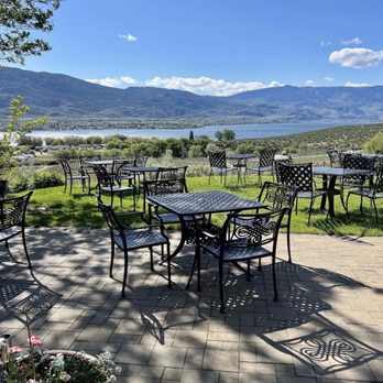 Nk'Mip Cellars - a patio with tables and chairs - Beer, Wine & Spirits Near Me - Osoyoos, British Columbia Nk'Mip Cellars - a patio with tables and chairs - Beer, Wine & Spirits Near Me - Osoyoos, British Columbia