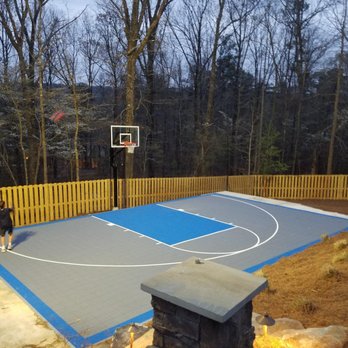 Landscape Professionals - a man playing basketball on an outdoor court - Landscaping Near Me - Trussville, Alabama Landscape Professionals - a man playing basketball on an outdoor court - Landscaping Near Me - Trussville, Alabama