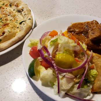 Anmol Restaurant - Milwaukee - Garlic naan, mutton Korma, Qeema samosas, and a salad. - Indian Near Me - Milwaukee, Wisconsin