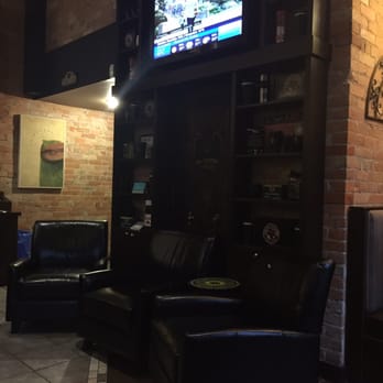 Coffee Culture - a living room with a television in the corner - Coffee & Tea Near Me - Woodstock, Ontario Coffee Culture - a living room with a television in the corner - Coffee & Tea Near Me - Woodstock, Ontario