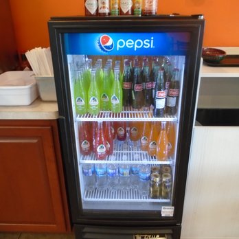 Guac N' Roll - A small cooler with other beverage options like Jarritos soda. - Mexican Near Me - New Richmond, Wisconsin